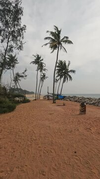 Freshwater lake meets the sea at Kappil Beach near Varkala, India .cloudy skies, tropical nature, and rare coastal serenity in one scenic view.