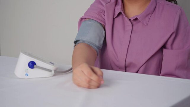 Closeup Of Woman Checking her Blood Pressure