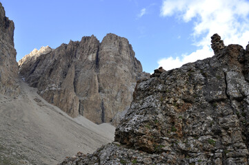 Fototapeta premium A ravine or valley formed between two large rocks in the Gray Mountains is covered with snow. The snowy valley between the mountains is used as a road