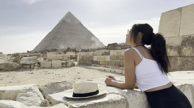 Join a tourist visiting the Great Pyramid of Giza in Egypt, a true wonder of the world. Explore the ancient marvels of the Giza Plateau and witness history.