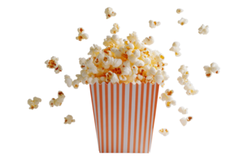 Close-up of a striped popcorn box overflowing with fluffy, buttery popcorn