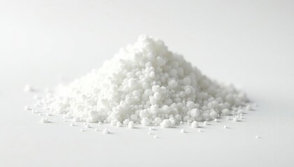 Pile of white granulated sugar on white background, powdered sugar, still life