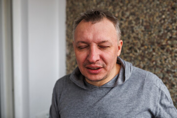 Obraz premium face of angry person dissatisfied with life and everything that happens. man is grimacing