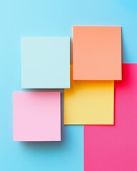 Fototapeta premium Vibrant Sticky Note Quartet: An arrangement of colorful sticky notes arranged on a creatively contrasting and colorful background.