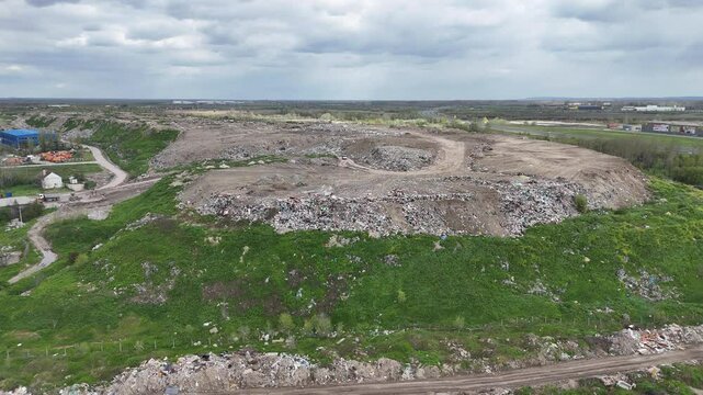 Aerial View of Open Pit Quarry or Landfill with Circular Road Pattern