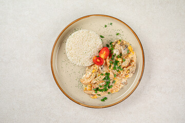 Portion of gourmet chicken fricassee with rice