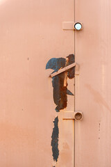A damaged warehouse metal door