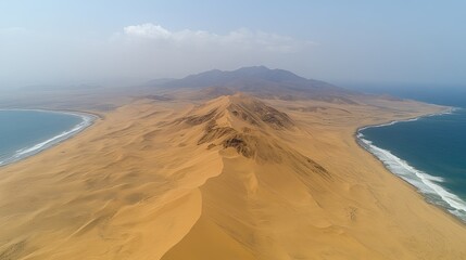 Aerial view depicts a desert peninsula separating the oceans blue waters