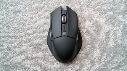 A bluetooth mouse on a textured fabric surface, ergonomic design emphasis 