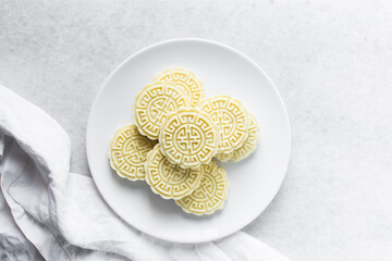 overhead view of tuwon madara on a white plate, nigerian alawar madara milk candy, top view of milk...