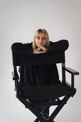 young woman sitting on chair