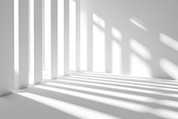 Obraz premium White room interior with sunlight casting shadows through vertical architectural elements.