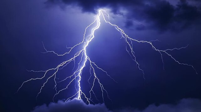 Electric forks of lightning streak down from dark ominous storm clouds during a severe weather event, bringing potential energy.