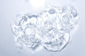 Crystal Clear Water Ripples and Droplets on a White Background