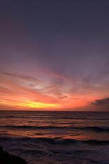 Beautiful orange sunset over the ocean. Evening sky after sunset