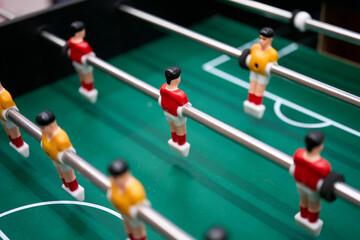 Foosball table. An enjoyable game for the old to remember and the young to learn, which promotes healthy competition, friendship.                               