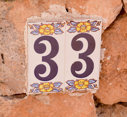 House number 33 sign