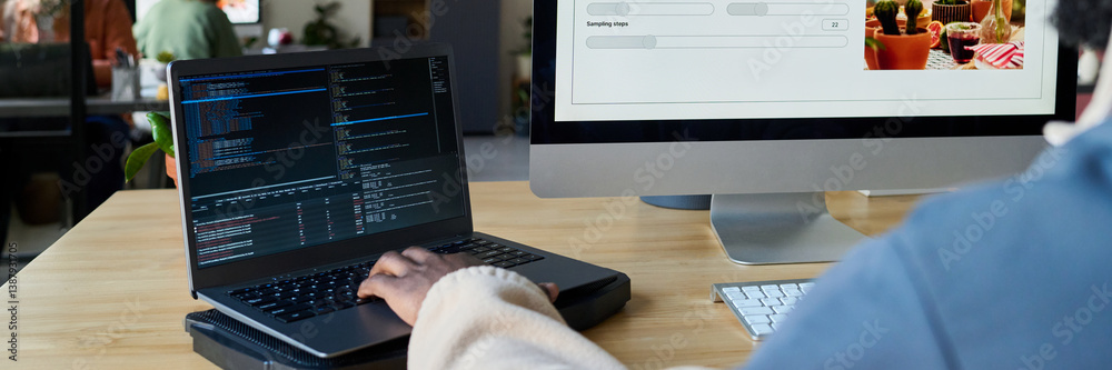 Aufkleber Header of two desktop computers and hand of young male programmer typing on laptop keypad while decoding data