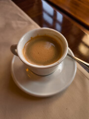 Enjoying a creamy coffee Lungo in a prague cafe, springtime treat