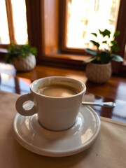 Enjoying a cup of coffee Lungo in a prague cafe in april