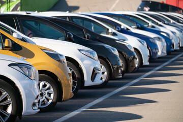 A lot of cars in a rows. Used car sales