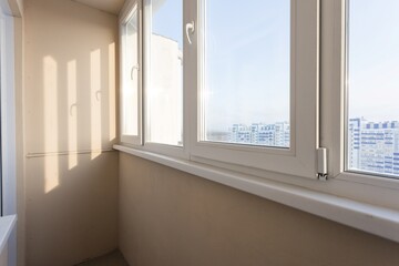 the balcony of an apartment on the upper floors of an apartment building