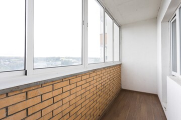 Fototapeta premium the balcony of an apartment on the upper floors of an apartment building