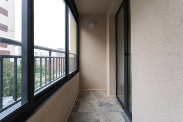 the balcony of an apartment on the upper floors of an apartment building
