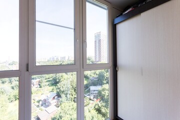 the balcony of an apartment on the upper floors of an apartment building
