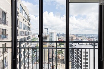 Fototapeta premium the balcony of an apartment on the upper floors of an apartment building