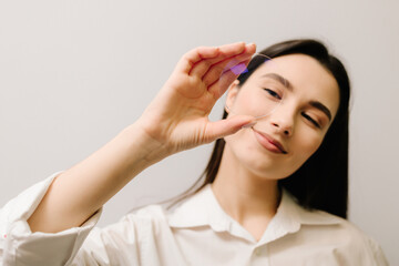Naklejka premium Lens designed for vision correction, anti-glare protection, and premium eyewear solutions. Girl with eyeglass lens, showcasing its clarity, precision, and advanced optical technology.