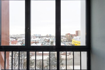 Fototapeta premium the balcony of an apartment on the upper floors of an apartment building