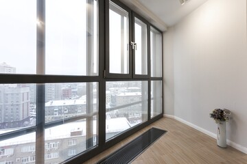the balcony of an apartment on the upper floors of an apartment building