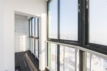the balcony of an apartment on the upper floors of an apartment building