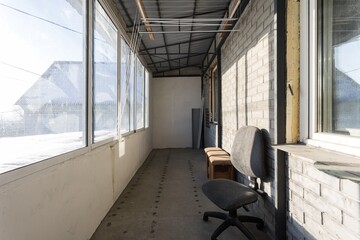 the balcony of an apartment on the upper floors of an apartment building