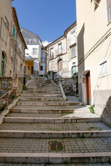 A narrow street among the old houses of Ripamolisani, a medieval village in Molise, Italy.