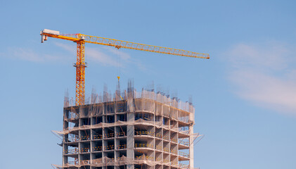 Construction site with tower crane and building framework in Astana, Kazakhstan