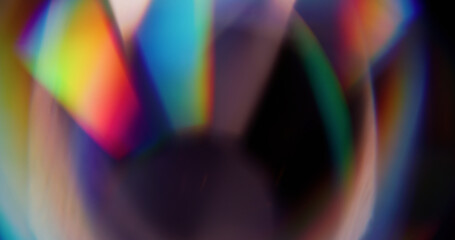 Bokeh ray. Blur radiant sparkle. Defocused blue green red colorful round lens optical flare floating on abstract dark black background.