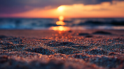 Close-up of sand texture at sunset, blurry ocean background, warm orange and purple tones, evokes tranquility and serenity