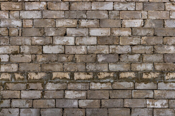 Rough Brick Wall with Minimal Mortar and Cracked Bricks