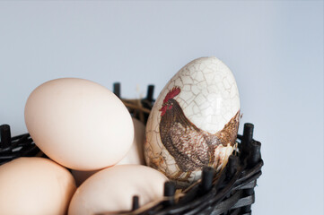 Wicker basket of eggs with easter egg Easter time 