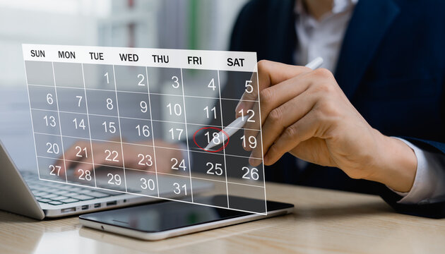 Businessman efficiently manage work time. Calendar on virtual screen interface. Highlight appointments and agenda notifications in the calendar. Time management concept