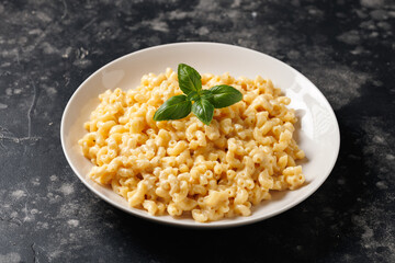 Creamy mac and cheese macaroni in a white bowl