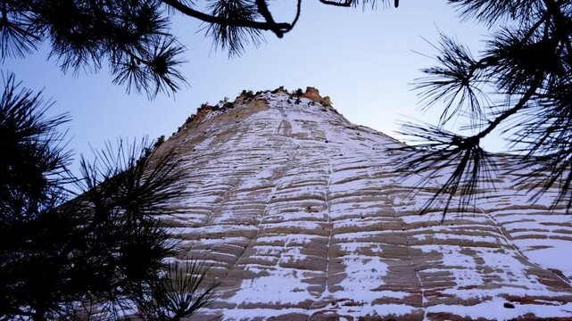 Winter landscape of Zion National Park showcasing snow-covered cliffs and clear blue skies, Zion National Park, Utah