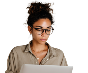 Focused woman wearing glasses and a casual shirt while using a laptop. She is looking down intently with her hair in a bun.