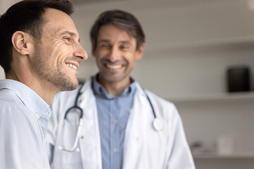 Positive healthcare experience, trust, insurance. Close up, smiling patient looks into distance with joyful expression, exuding optimism and satisfaction with effective treatment, doctor in background