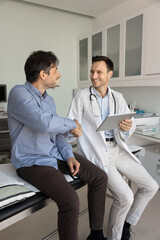 Satisfied middle-aged patient received clear explanation of condition agreed on treatment plan,...
