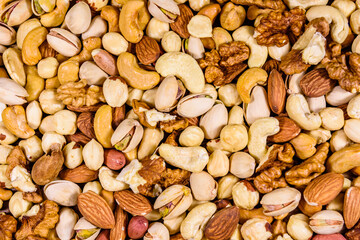 Background of the various nuts (almond, cashew, hazelnut, pistachio, walnut). Vegetarian meal. Healthy eating concept