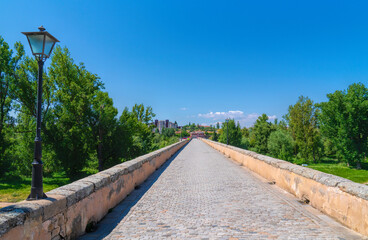 Long straight roman bridge historic ancient construction Salamanca Castile and Leon Spain