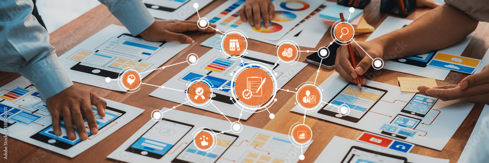 Fototapete A diverse team engages in collaborative project development with design prototypes and digital platforms, illustrating modern strategy planning in a professional setting. Amity